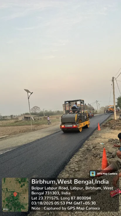 Road paving in progress on a bituminous road